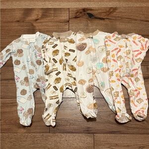 Burt’s Bee set of 4 footies. Size 0-3 months